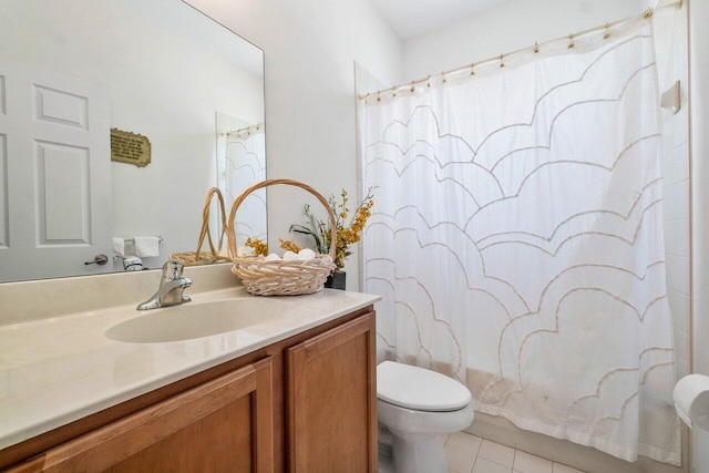 bathroom featuring tile patterned floors, vanity, and toilet