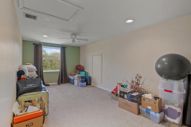 playroom with light carpet and ceiling fan