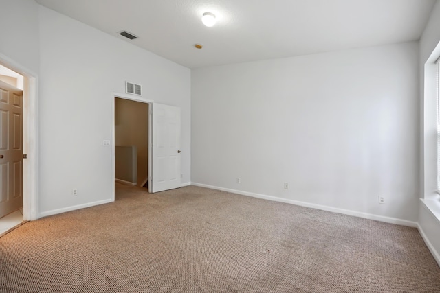 empty room with carpet flooring