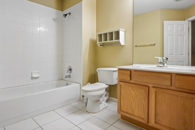 full bathroom with tile patterned floors, toilet, tiled shower / bath combo, and vanity