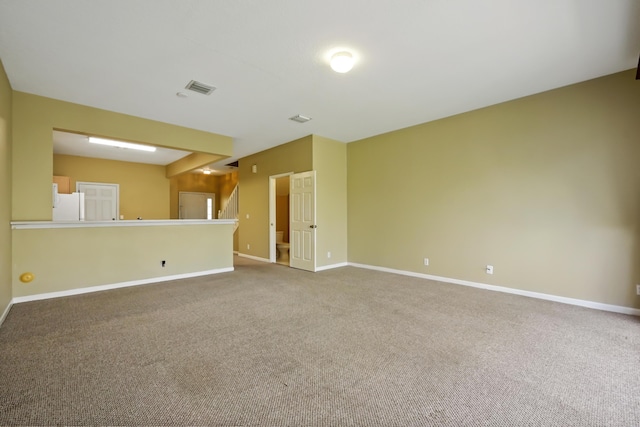 unfurnished living room with carpet floors