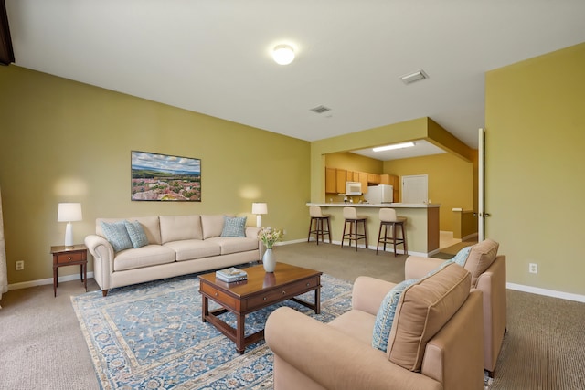 living room featuring light colored carpet