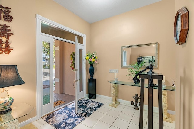 foyer featuring light tile patterned floors