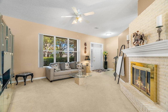 living room featuring ceiling fan, carpet floors, and a brick fireplace