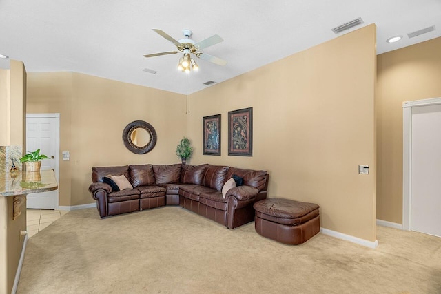 living room featuring light colored carpet and ceiling fan