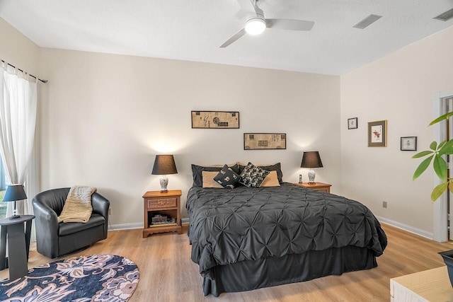 bedroom featuring light wood-type flooring and ceiling fan