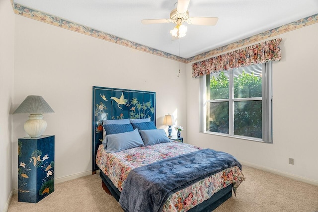 bedroom featuring ceiling fan and light colored carpet