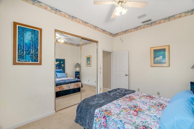 bedroom featuring ceiling fan, a closet, and carpet floors