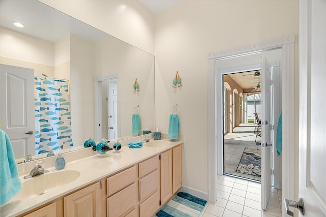 bathroom featuring walk in shower, vanity, and tile patterned flooring