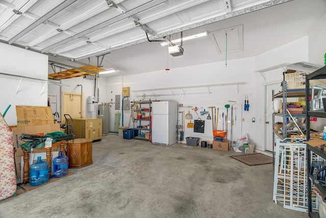 garage with electric panel, electric water heater, white fridge, and a garage door opener