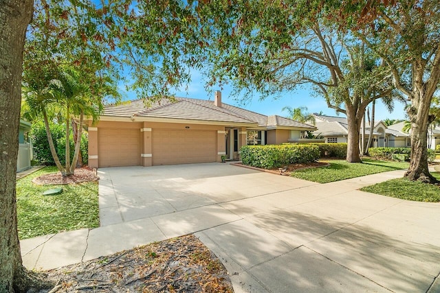 ranch-style house featuring a garage