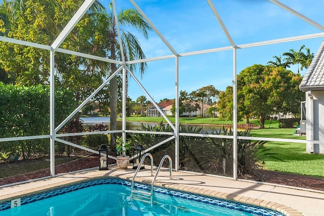 view of swimming pool with a water view and glass enclosure