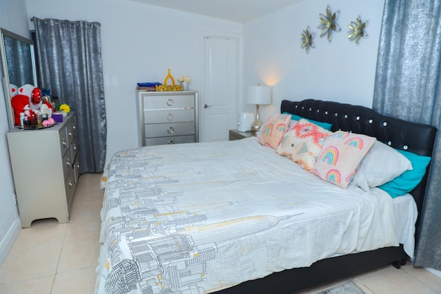 bedroom with light tile patterned flooring