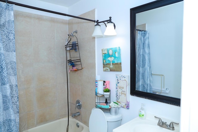 full bathroom featuring shower / tub combo with curtain, toilet, and sink