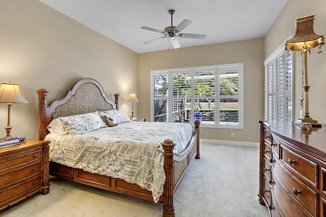 bedroom with light colored carpet and ceiling fan