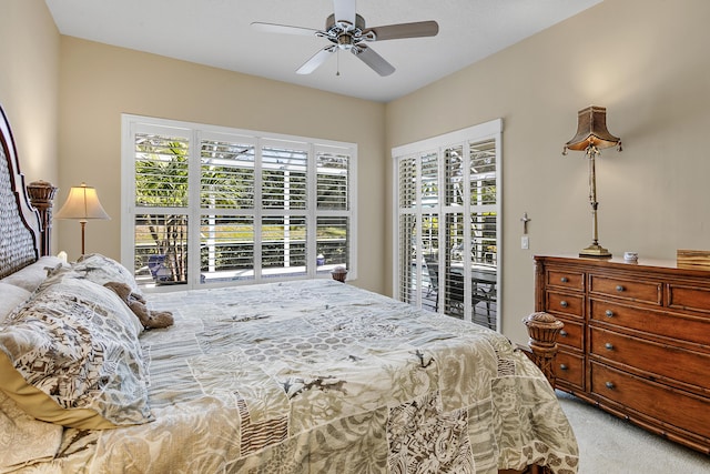 carpeted bedroom featuring access to outside and ceiling fan