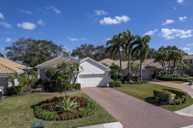 view of front of home featuring a garage and a front lawn