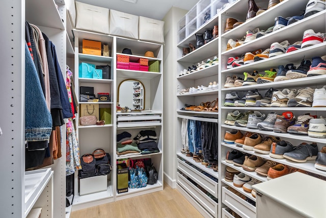 walk in closet featuring light hardwood / wood-style flooring