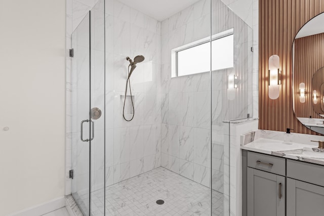 bathroom featuring vanity and a shower with shower door