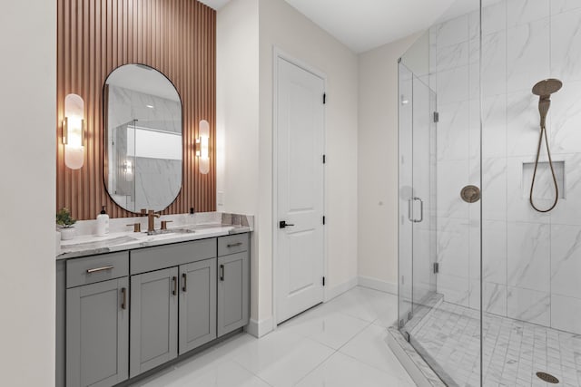 bathroom with vanity and a shower with door