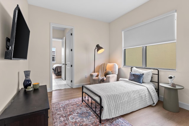 bedroom with light wood-type flooring