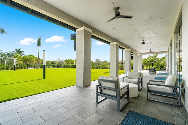 view of patio / terrace with ceiling fan and an outdoor living space