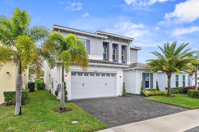 view of front of property featuring a garage and a front yard