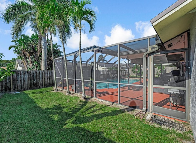 exterior space featuring a fenced in pool and a lanai