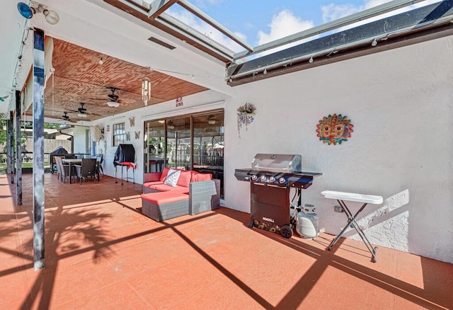 view of patio / terrace with area for grilling, an outdoor hangout area, and ceiling fan