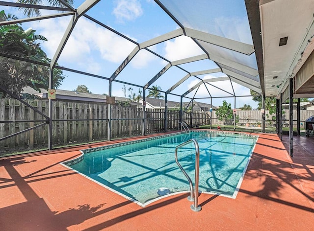 view of pool with a lanai and a patio area