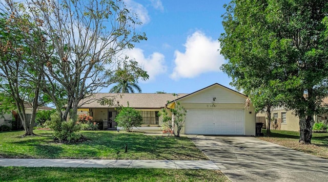 single story home featuring a garage and a front yard