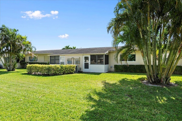 ranch-style house with a front yard