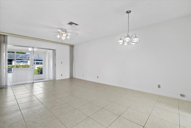 unfurnished room featuring ceiling fan with notable chandelier, a textured ceiling, and light tile patterned floors