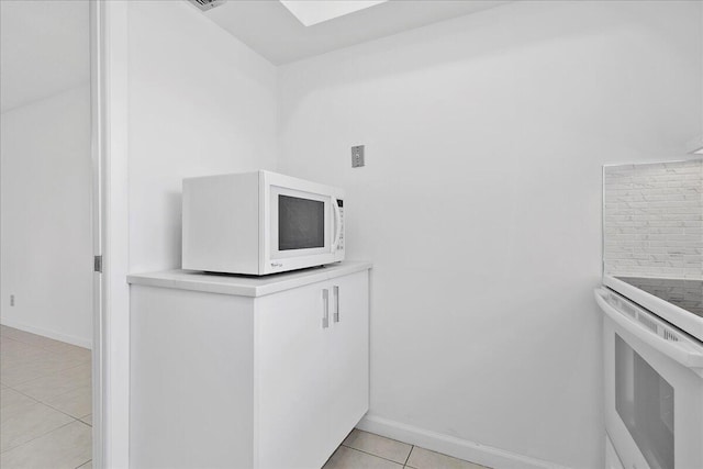 kitchen featuring light tile patterned flooring