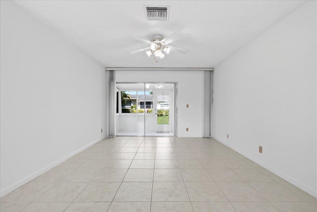 tiled empty room with ceiling fan