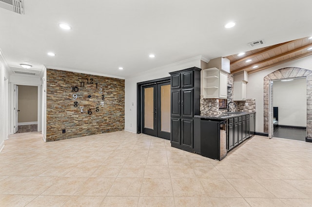 kitchen featuring sink, decorative backsplash, ornamental molding, and light tile patterned flooring