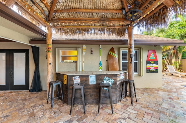 view of patio with an outdoor bar