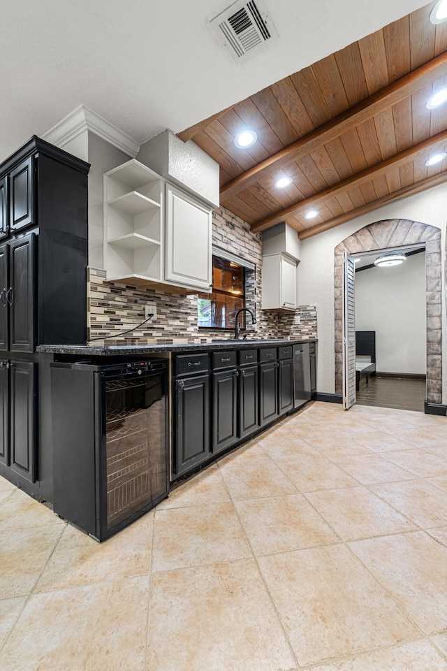 kitchen with sink, tasteful backsplash, wood ceiling, light tile patterned floors, and dishwasher