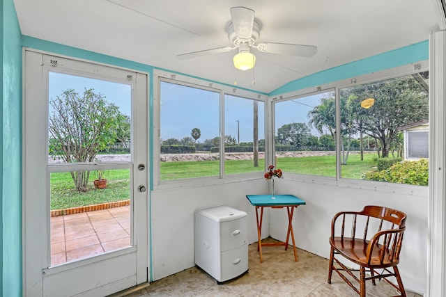 sunroom featuring ceiling fan and a wealth of natural light