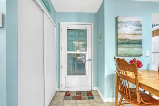 entryway with light tile patterned floors