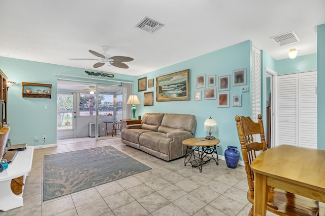 tiled living room featuring ceiling fan