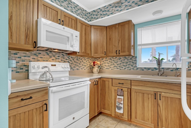 kitchen featuring sink, backsplash, white appliances, and light tile patterned floors