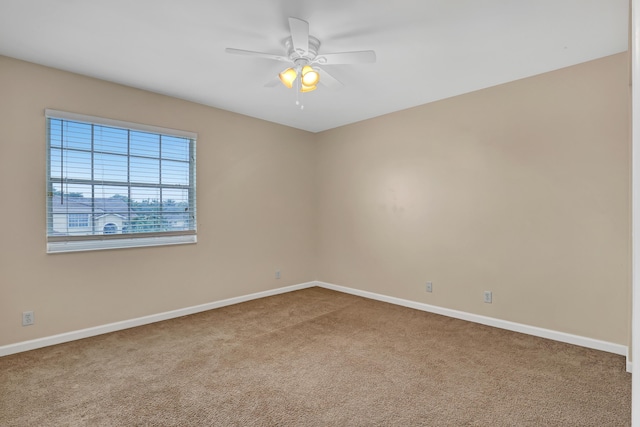 unfurnished room featuring carpet flooring and ceiling fan