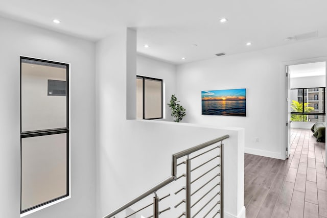 hall with light hardwood / wood-style floors