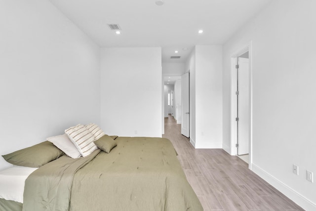 bedroom with light wood-type flooring