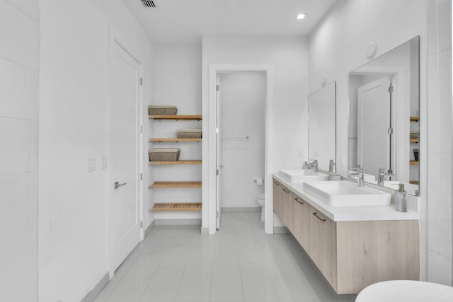 bathroom with toilet and vanity