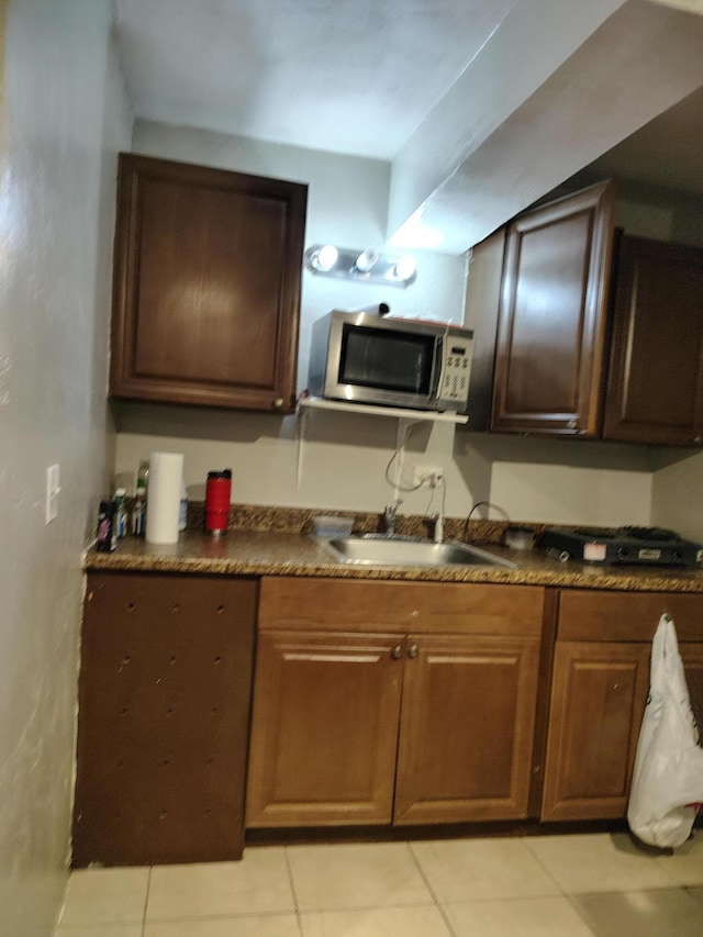 kitchen with sink and light tile patterned floors