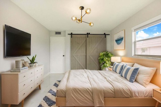 bedroom featuring a barn door, visible vents, and a chandelier