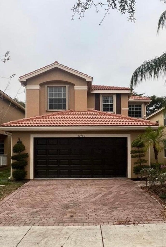 view of front of property with a garage