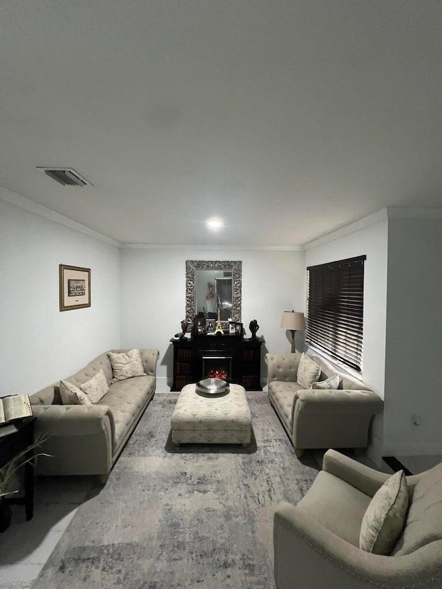 living room featuring crown molding